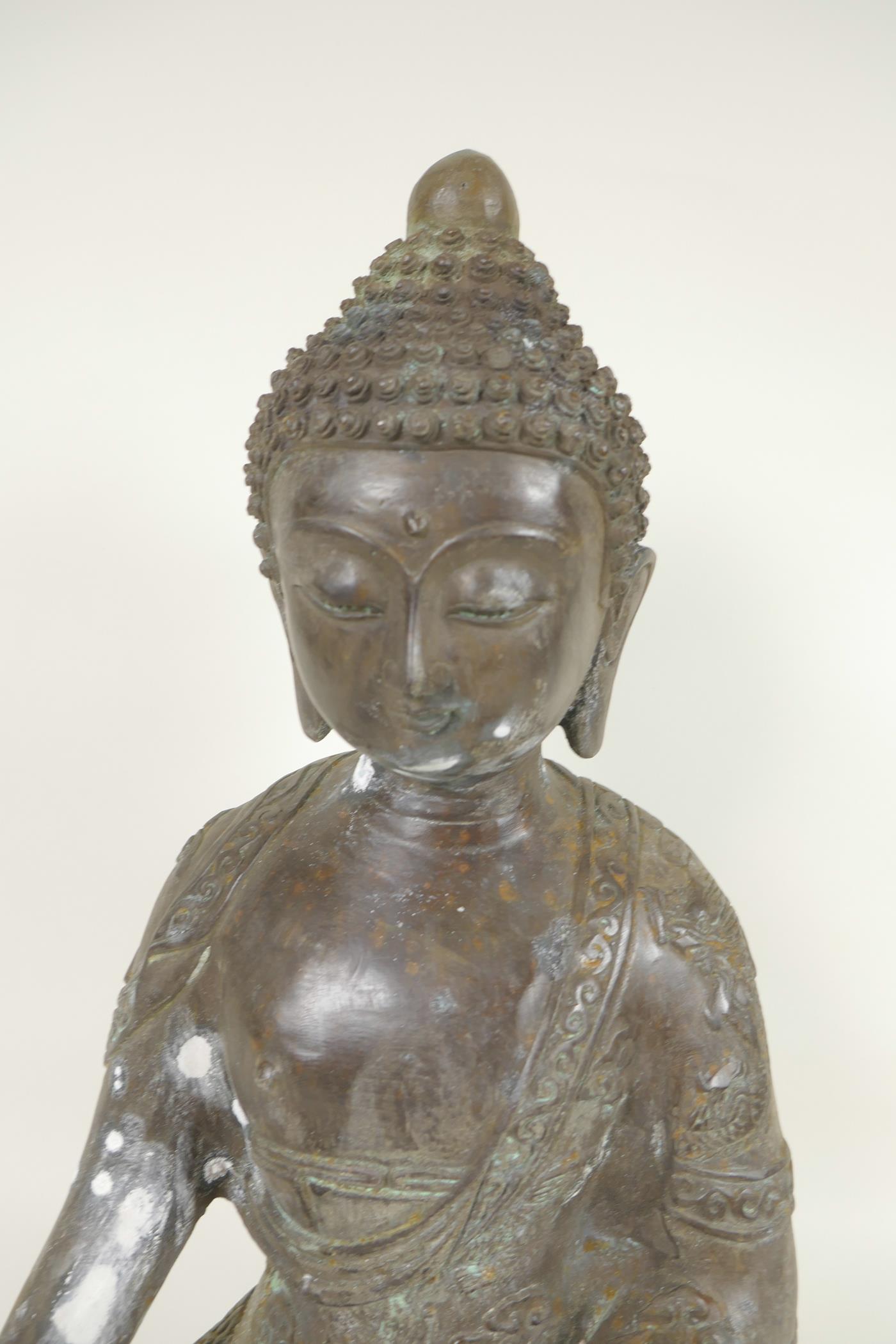 A Chinese cast bronze figure of Buddha seated in the lotus position whilst meditating, cast 6 - Image 2 of 5