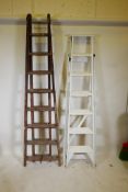 A painted vintage G.A. Jones patent step ladder, and another vintage extending ladder, largest 87"