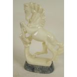 A carved alabaster figure of a horse, 9" high, A/F