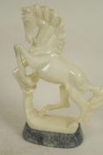 A carved alabaster figure of a horse, 9" high, A/F