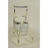 A silver plated cruet, the stand in the form of a bar back chair, 8" high
