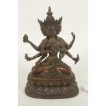 A bronze Buddhistic figure with eight arms, seated upon a lotus throne, pendant 2" high