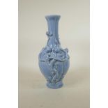 A Chinese duck egg blue glazed porcelain vase with applied peach tree decoration, seal mark to base,