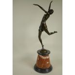 An Art Deco style figure of a dancing girl on a marble plinth, 26" high