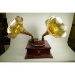 A replica twin horn wind up gramophone with brass horn, 17" square