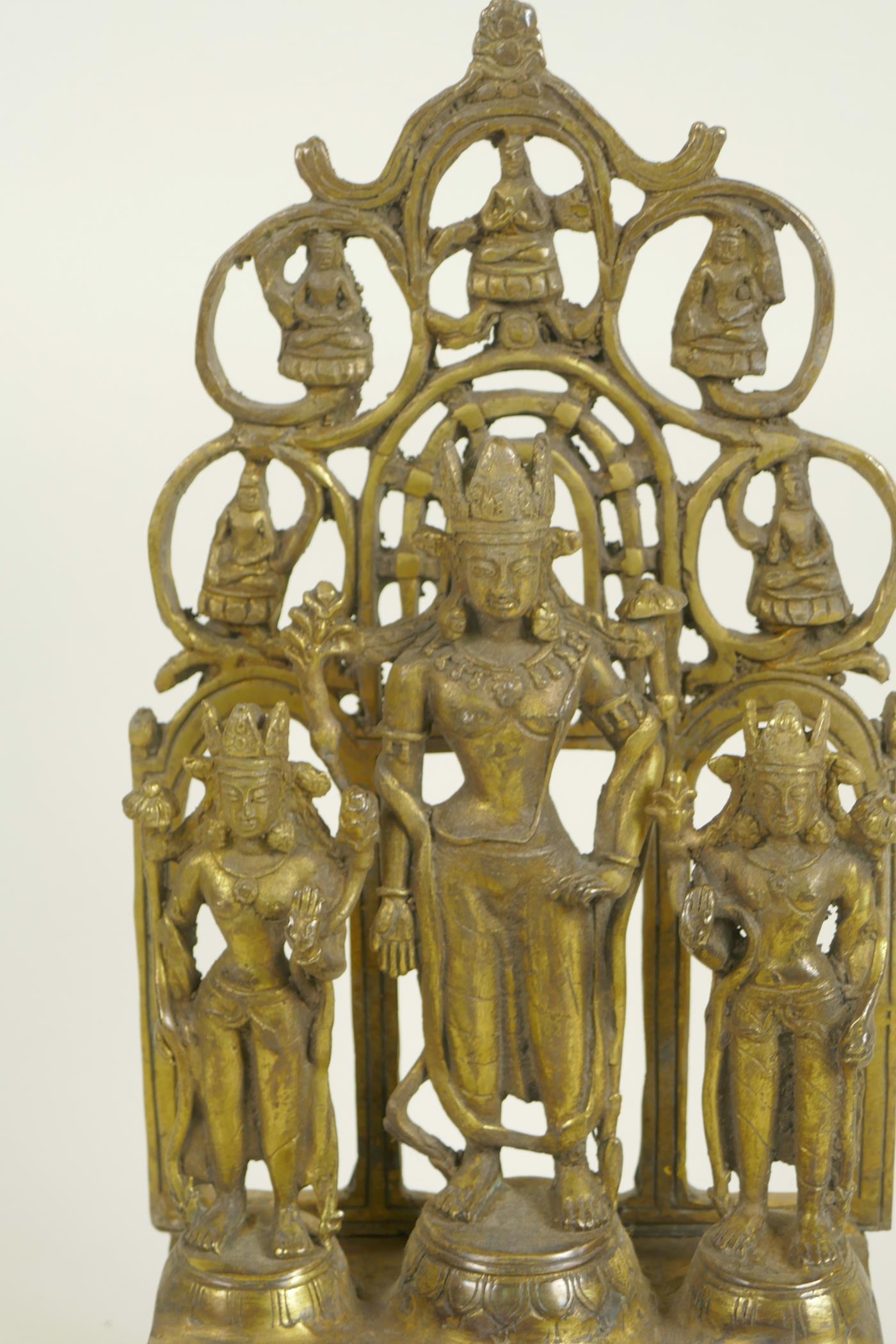 A Chinese gilt bronze figure of three deities standing before a pierced screen decorated with - Image 2 of 5