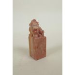 A Chinese soapstone seal blank with carved kylin surmount, 3" high