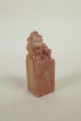 A Chinese soapstone seal blank with carved kylin surmount, 3" high