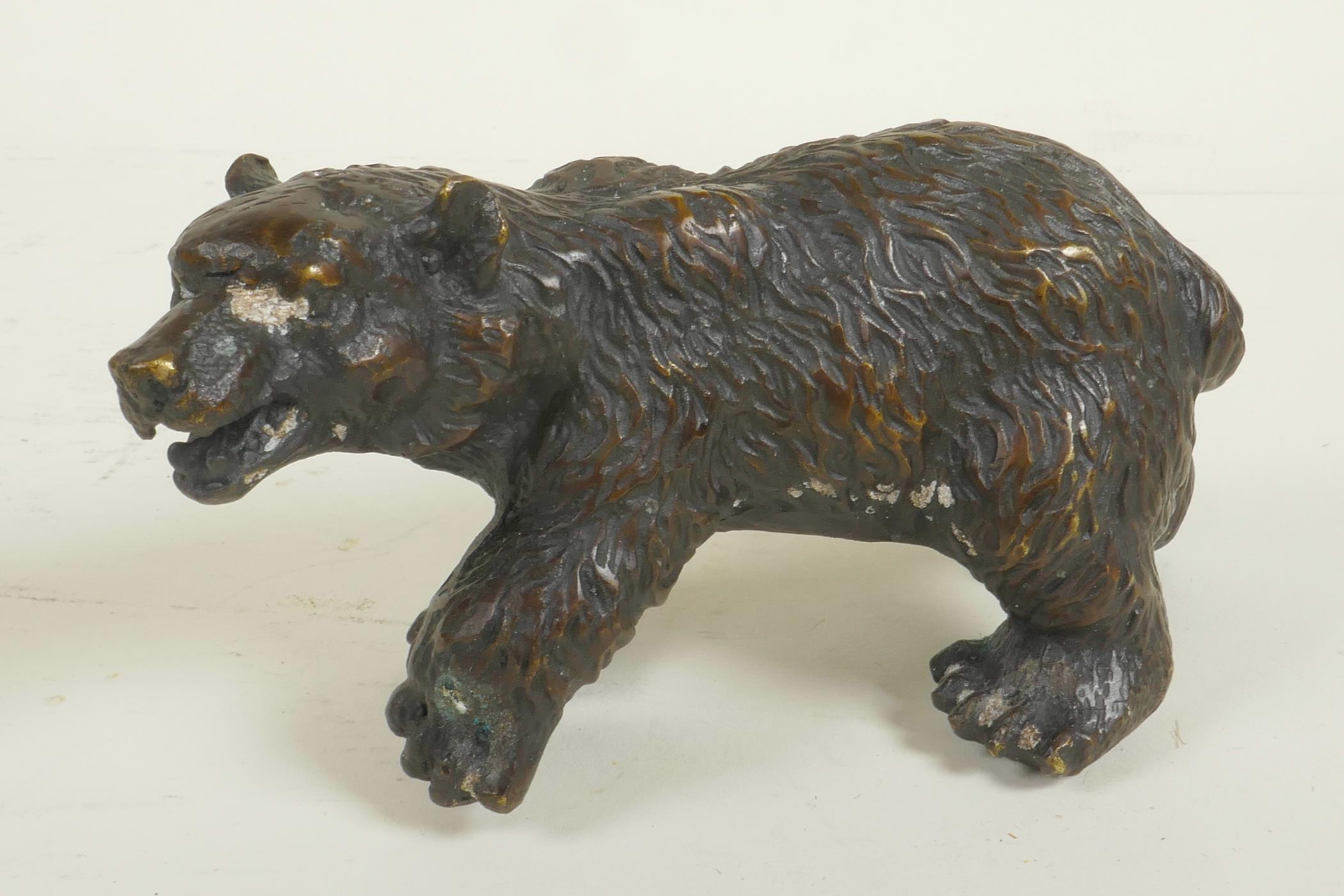 A bronze figure of a brown bear, 7" long
