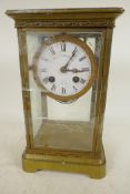 An American brass cased four glass mantel clock with twin train movement striking on a gong, white