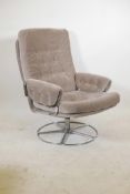 A late C20th chrome swivel armchair, with button back upholstery