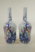 A pair of Chinese blue and white porcelain vases with polychrome enamel decoration depicting Asiatic