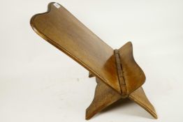 A Georgian mahogany folding bookstand made from a single piece of timber, 18½" x 11¾"