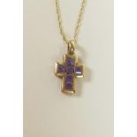 A 9ct yellow gold and amethyst set crucifix pendant necklace, ¾" drop