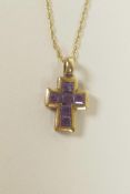A 9ct yellow gold and amethyst set crucifix pendant necklace, ¾" drop