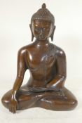A cast brass figure of Shakyamuni Buddha seated in meditation, 12" high