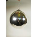 An Art Deco mirrored glass globe with decorative copper hanging attachment, comes with wall bracket,
