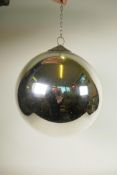 An Art Deco mirrored glass globe with decorative copper hanging attachment, comes with wall bracket,