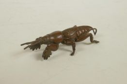 A Japanese Jizai style bronze of an insect, impressed mark to base, 2½" long