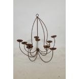 A wrought iron ten branch chandelier, A/F, 31½" drop