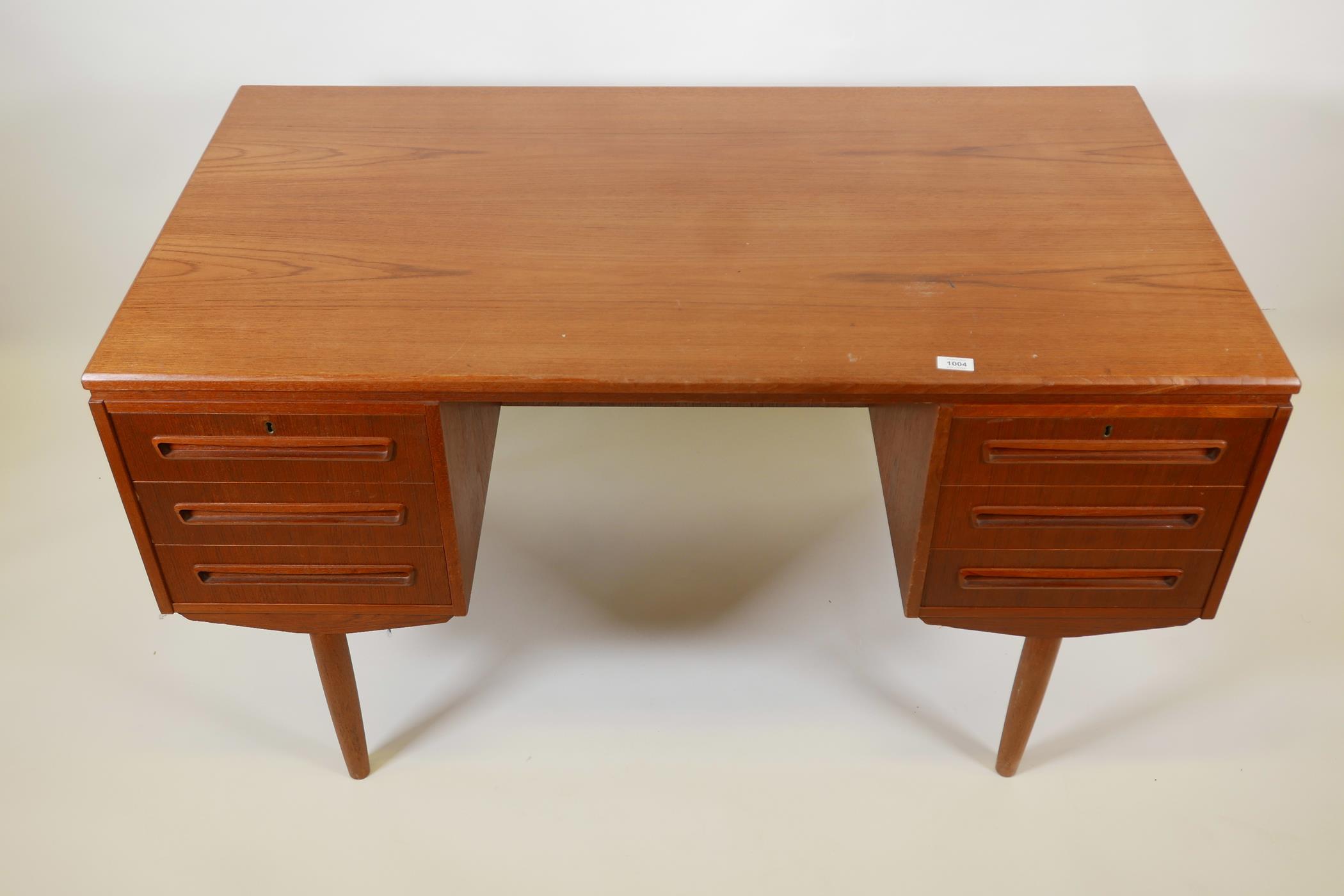 A Danish 1960s teak two sided desk designed by J. Svenstrup for A.P. Møbler, with six drawers to one - Image 2 of 4