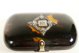 A C19th tortoiseshell pocket purse with silver vacant cartouche and blue silk interior, 3" x 2"