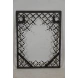 An Indian wrought iron mirror frame with lattice style decoration, 23" x 30"