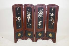 A Japanese lacquer four panel screen with inset bone, mother of pearl and wood decoration