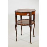 A French style mahogany two tier occasional table, with a satinwood painted top and shaped gallery