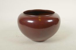 A Chinese copper glazed porcelain jar with a rolled rim, impressed seal mark to base, 6½" diameter