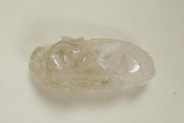 A Chinese carved rock crystal paperweight in the form of a vine, 4½" long