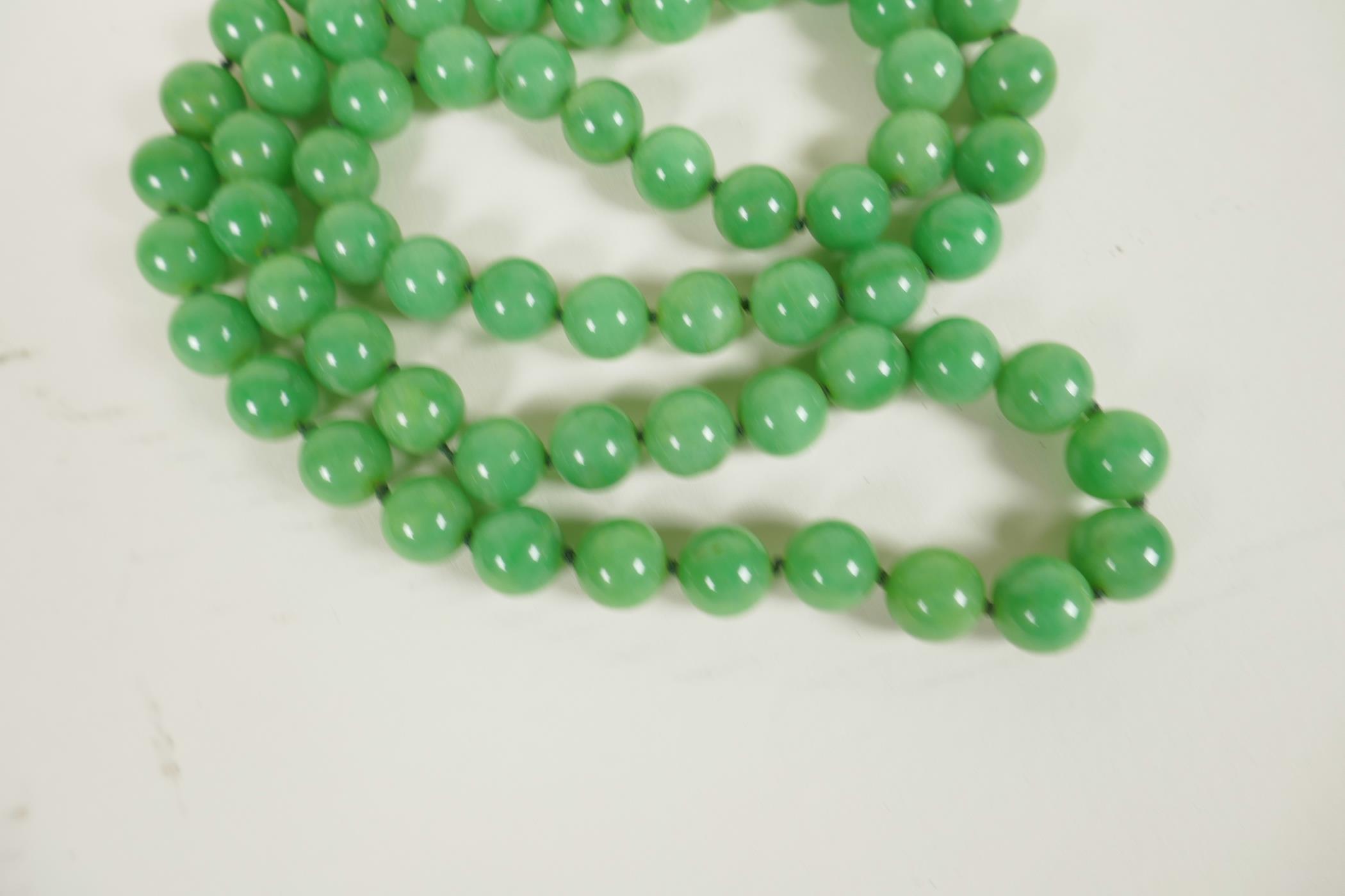 A string of light green jade beads, 34" long - Image 2 of 2