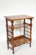 A Liberty & Co. Arts and Crafts three tier book stand with turned lattice work sides, 23" x 13½",