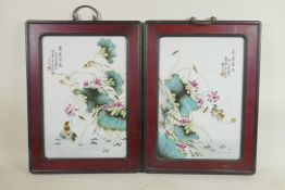 A pair of Chinese Republic period porcelain panels decorated with lotus flowers and birds, in a