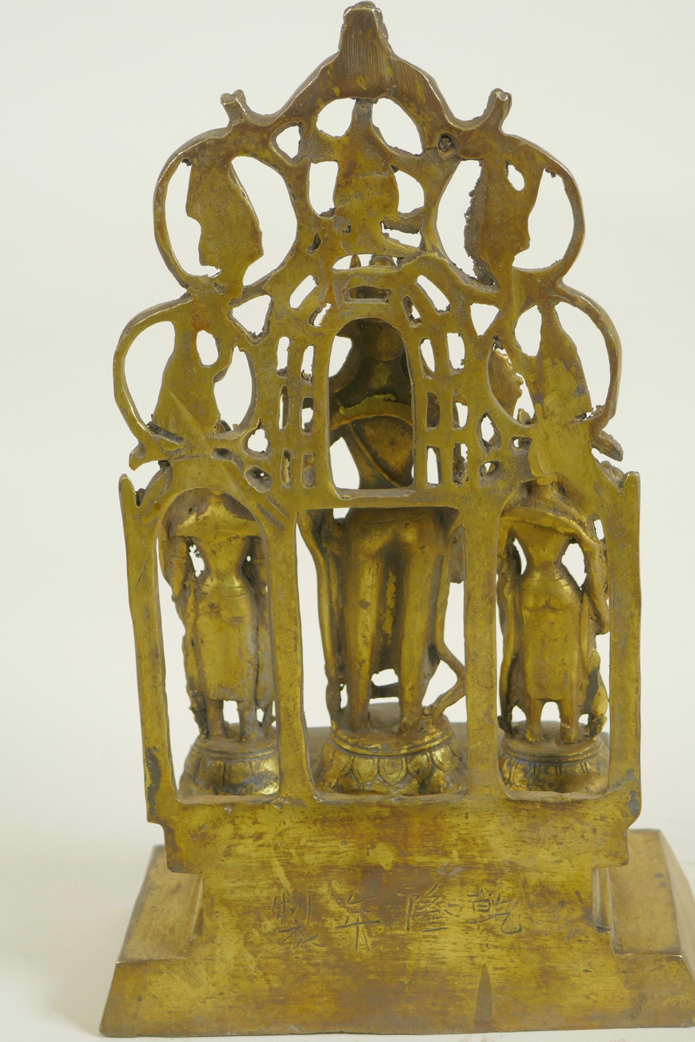 A Chinese gilt bronze figure of three deities standing before a pierced screen decorated with - Image 4 of 5