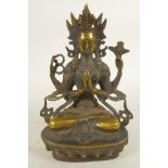 A Chinese bronze figure of a Buddhist deity seated in meditation, 8" high