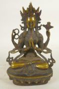 A Chinese bronze figure of a Buddhist deity seated in meditation, 8" high