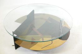 A contemporary occasional table, with glass top and lacquered base with exotic wood inlaid