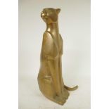 An Art Deco stylised bronze figure of a seated jaguar, 15¾" high