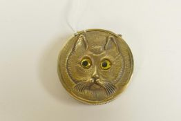 A brass vesta case with Louis Wain style cat decoration, 1½" diameter