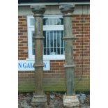 Architectural Salvage: A pair of Indian painted teak columns with carved capitals, mounted on carved