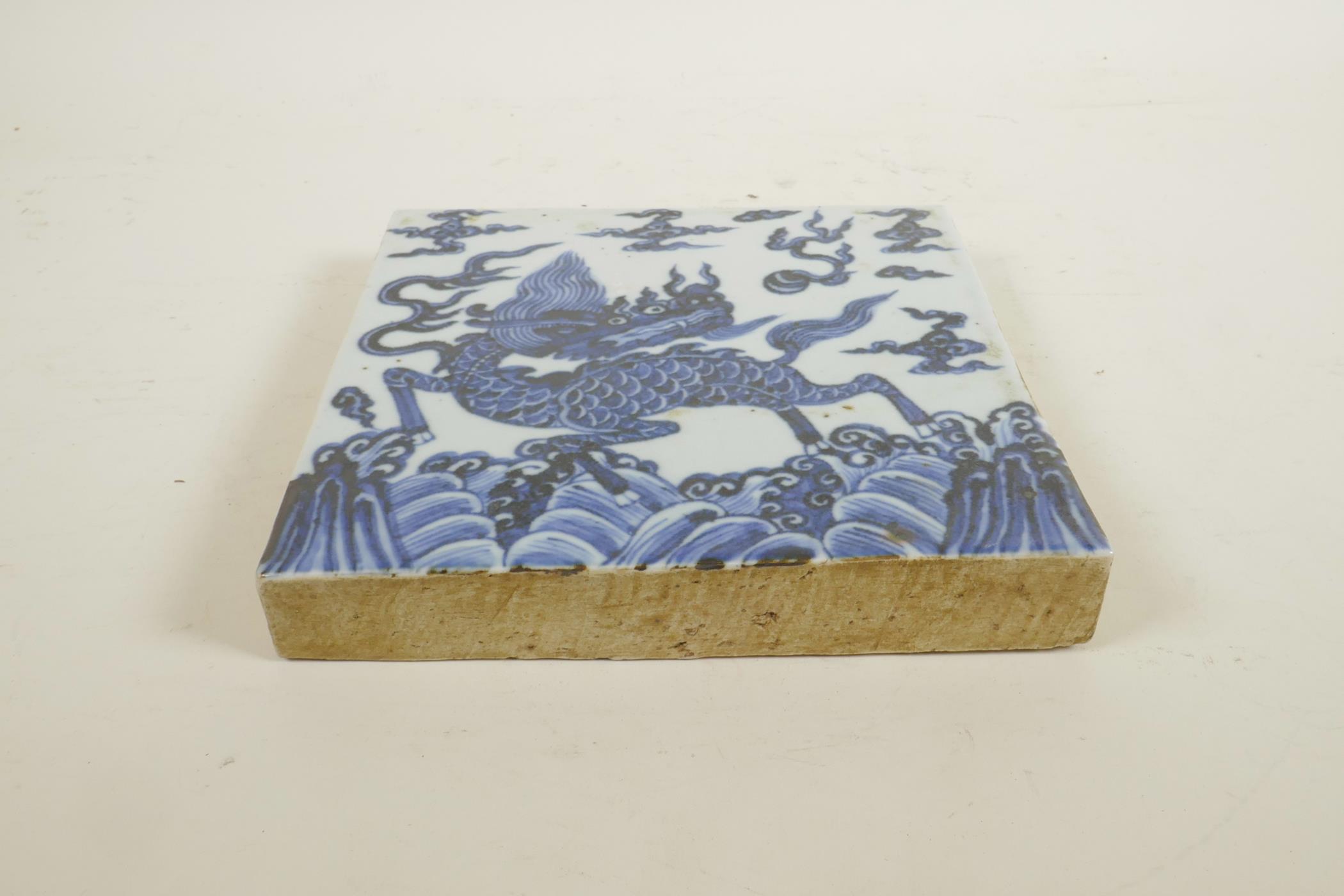 A Chinese blue and white porcelain temple tile decorated with a kylin, 8" x 8" - Image 2 of 3