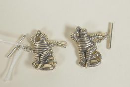 A pair of sterling silver Michelin man cufflinks