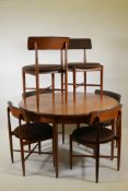 A mid century G-Plan teak 'Fresco' extending dining table and six chairs, designed by Victor B.