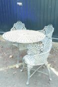 A painted, wrought iron Victorian style garden table and three chairs, 40" diameter