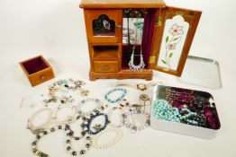 A retro jewellery box in the form of a wardrobe containing costume jewellery, together with a