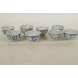 Eight C19th Chinese blue and white porcelain wine cups, 1¾" diameter