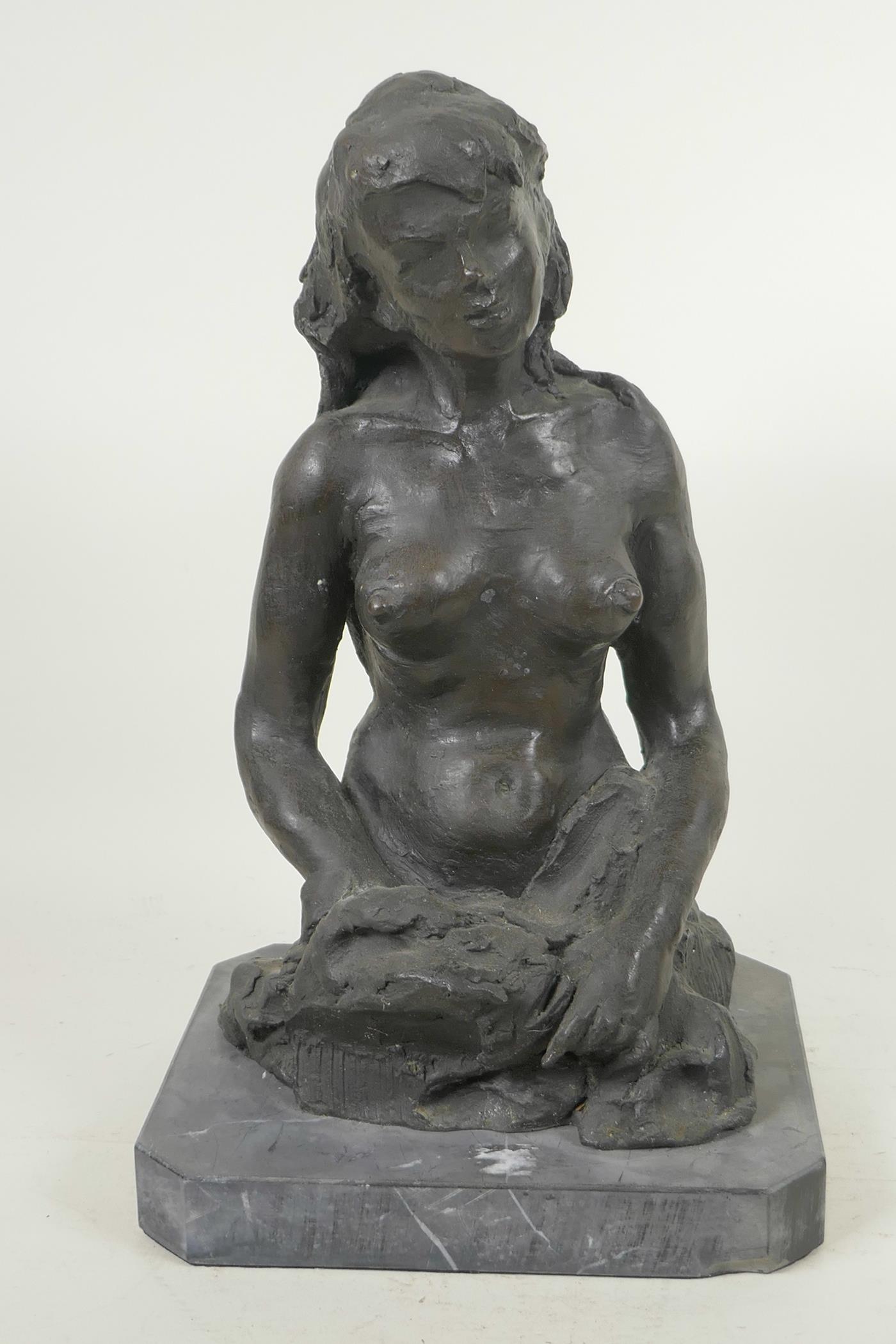 A modernist bronze figure of a female nude, on a slate base, 13½" high