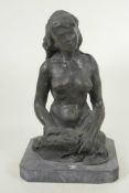 A modernist bronze figure of a female nude, on a slate base, 13½" high