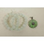 A 925 silver daisy shaped pendant set with green jade and marcasite, together with two jade beaded